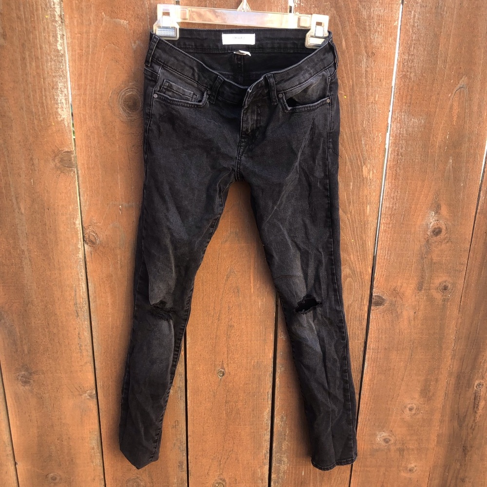 Women’s black ripped jeans